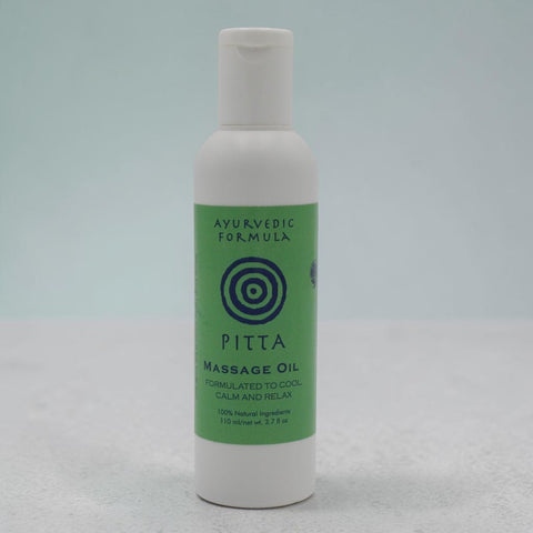 House of Nepal Ayurvedic Pitta Massage Oil, formulated to cool, calm, and relax. Green label with concentric circles.