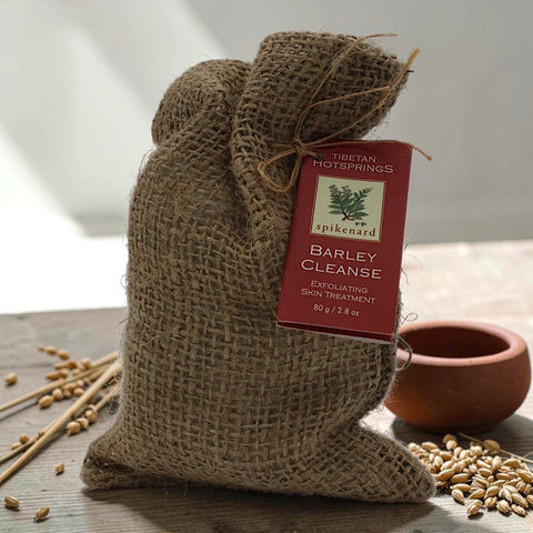 House of Nepal Barley Cleanse exfoliating skin treatment in a burlap bag with a red tag.
