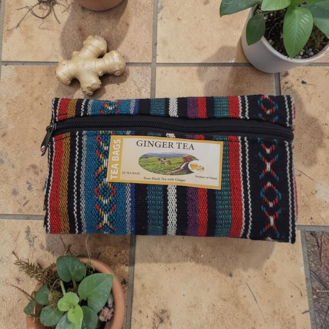 House of Nepal ginger tea in a colourful woven pouch with 25 tea bags. The pouch has a black zipper and a black cord.