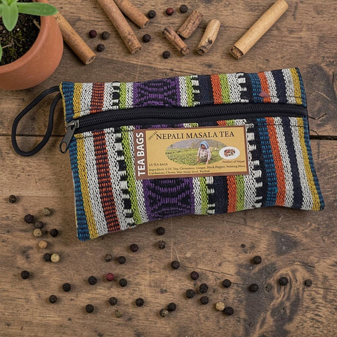 House of Nepal's colourful woven pouch containing 25 bags of Nepali Masala Tea with cinnamon, ginger, cardamom, and cloves.