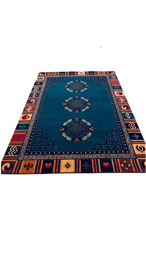House of Nepal Nepalesischer Sanumaya Teppich 120x180cm, blau mit Medaillons und geometrischem Rand, 100% tibetische Schafwolle