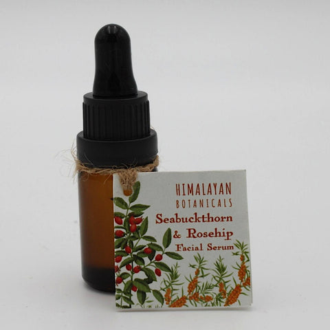 House of Nepal amber glass bottle of Seabuckthorn & Rosehip facial serum with dropper lid and twine tie. Label features botanical illustrations.