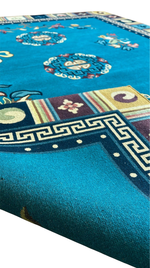 House of Nepal Nepalesischer Phulmaya Teppich 175x225 cm, handgeknüpft aus tibetischer Wolle in Türkis mit Medaillons und geometrischem Rand.