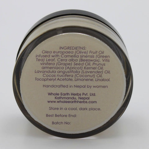 House of Nepal Lavender Body Balm in a glass jar, formulated with olive oil, beeswax, grape seed oil, apricot kernel oil, lavender oil, coconut oil, and green tea extract for dry skin.
