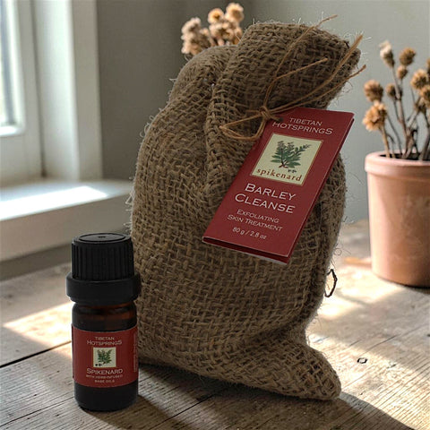 House of Nepal Barley Cleanse exfoliating skin treatment with white clay and spikenard oil in burlap bag.
