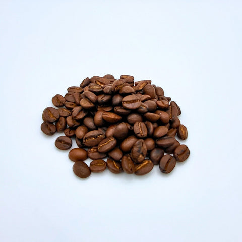 House of Nepal Bio Arabica coffee beans, medium-dark roast, with notes of chocolate and caramel.