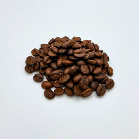 House of Nepal Jalpa Gold 1kg bag of medium-dark roasted organic Arabica coffee beans from Nepal with notes of chocolate, caramel, and nuts.