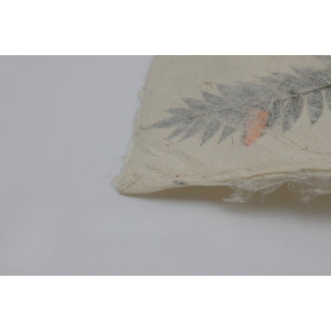 House of Nepal traditional Lokta paper gift wrap with pressed fern leaves and orange accents, 75x49 cm.