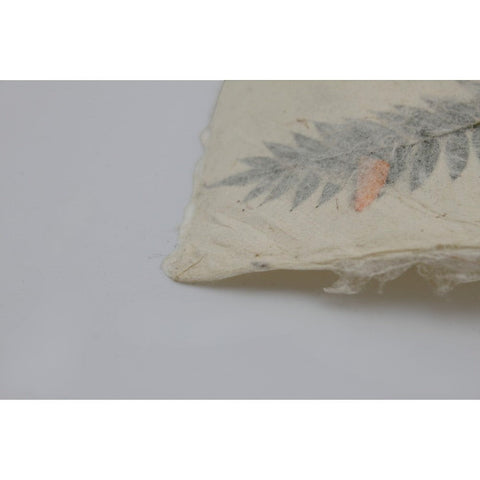 House of Nepal traditional Lokta paper gift wrap with pressed fern leaves and orange accents, 75x49 cm.