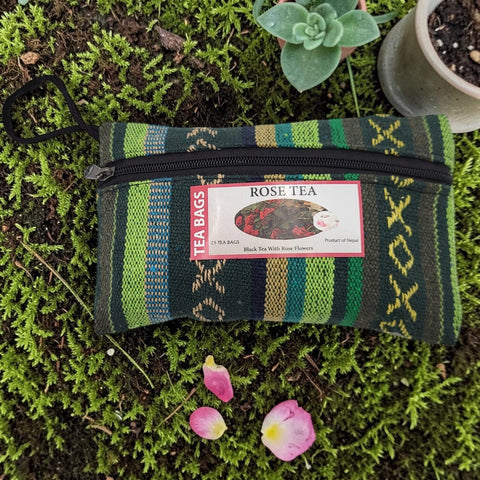 House of Nepal Rose Tea in a reusable green, blue, and yellow striped woven pouch with a zipper and loop. Contains 25 tea bags.